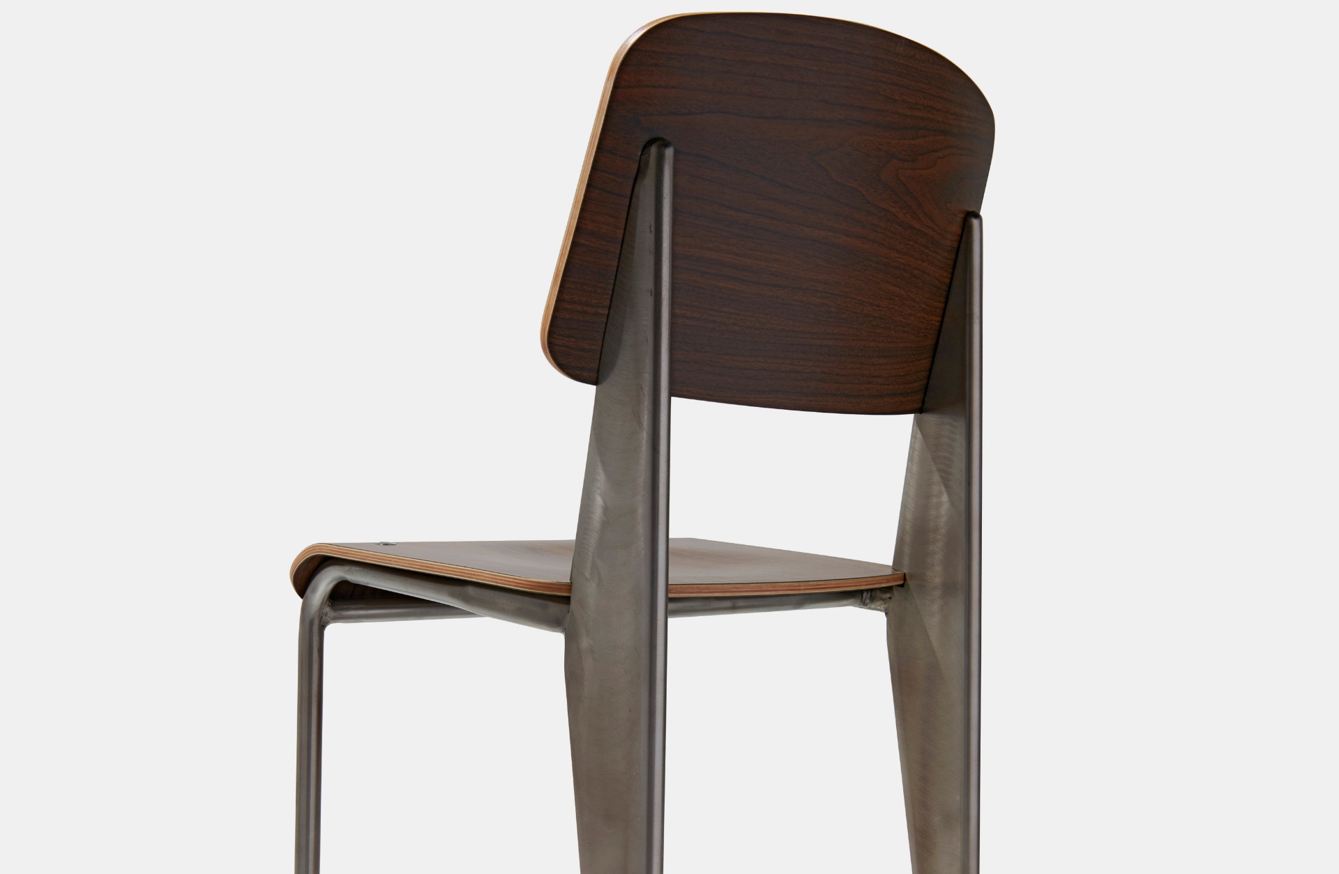 Walnut and gunmetal Jean Collection chair with a curved plywood seat and back